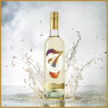A bottle of Seven Daughters Moscato wine is standing upright with a splash of liquid surrounding it against a light, cloudy background. Description generated by AI