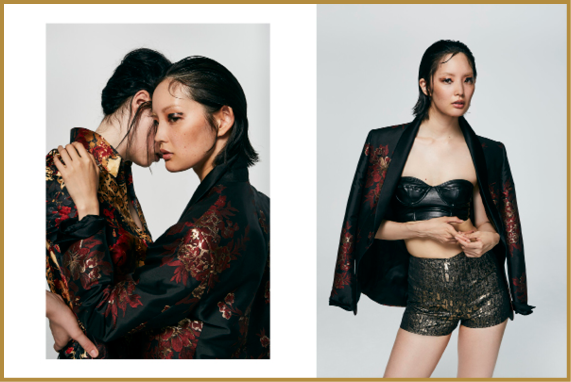 Two adults wearing dark, patterned jackets pose closely together on the left, while one adult on the right wears a matching jacket over a black crop top and patterned shorts against a plain background. Description generated by AI